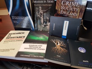 Eight books piled up